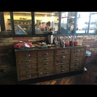 Bread bar that come with your food. A big hunk of bread to self cut and lots of pickled vegetables    at Saemundur i Sparifötunum in Reykjavik