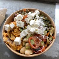 Small box with vegan feta. So good! at Bowls in Edinburgh