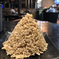 Side of brown rice for the stir fry. Arrived in this cone shape  at Buddha Thai Bistro in Vacaville