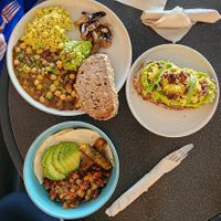 Top left: veggie English breakfast, replaced with tofu scramble. Bottom left: breakfast hash. Right: Avocado toast with tofu scramble. at Higher Grounds Cafe in Tubli