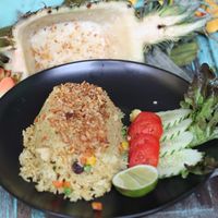 this absolutely tastes beautiful. Juicy Pineapple baked rice.  It has crispy onions in a sumptious pineapple rice bed. Addictive! at HOME Kitchen, Bar & Bed in Phuket