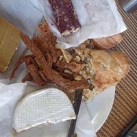 Camembert, smoked cheddar, goat cheese, bread, and some tofu jerky at TreeNut Cheezery in Ubud