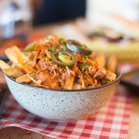 Loaded fries with vegan cheese sauce, jackfruit and jalapeños  at Mockingbird in Wellington