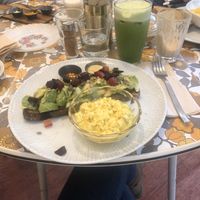 Avo toast with grilled beetroot and tofu scramble w fresh green juice and oat milk latte at Tiffin Cafe in Lisbon