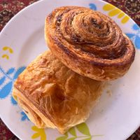 50 baht each - chocolate croissant and flaky cinnamon bun, both made with puff pastry. at Da's Home Bakery in Chiang Mai