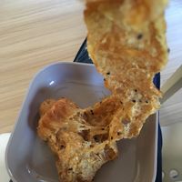 After a trip in the microwave - layered doughy “buttery” goodness. The sprinkle of sesame seeds added some nice texture too! at Da's Home Bakery in Chiang Mai