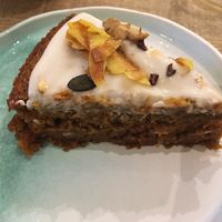 Vegan carrot cake with coconut frosting at Manna Porto in Porto