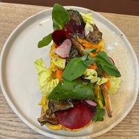 Bread loaded with veggies  at Manna Porto in Porto