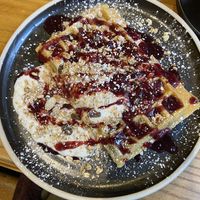 Breakfast spiced fruit and cinnamon infused granola waffles with cherry coulis   at The Waffle House in Norwich