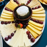 Cheeze plate to order - Shown for two. 
From bottoms, clockwise- mozzarella,pepperjack, Violife epic mature, smoked applewood. Centre is a soft “goat” style in herbs with sea  at Tom's Diner in Banbury