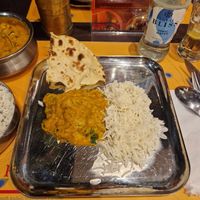 Main dish (Bhindi Masala) with Okra in a creamy tomato sauce served with rice. 
Additional roti bread. at Krishna Vilas in Utrecht