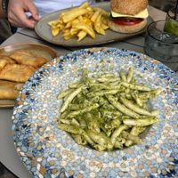 Vegan burger, pasta with pesto and greek dumplings filled with herbs  at Cafe12 in Crete
