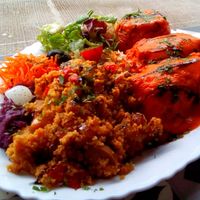 3 meals in 1 dish: millet stuffed tomato, cabbage rolls and paella at Vegan Story in Lisbon