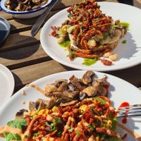 Scrambled tofu on granary toast and spinach with 'bacon' bits covered in spicy siracha at T @ the dials in Brighton