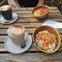 Two sweet tahini, pistachio and apricot overnight oats and two oat milk cappuccino (one decaf). All very good! at T @ the dials in Brighton