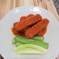 Spicy Wings with celery at Veggie Grill by Next Level in Cambridge