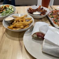 Strawberry lemonade, iced tea, Baja fish tacos, kimchi beef bowl, California wrap, fries, sweet potato fries, with chipotle aioli, Belgian chocolate cake, carrot cake  at Veggie Grill by Next Level in Cambridge