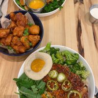 Crispy cauliflower, All hail Kale salad with vegan chikn added on top, Far east thai chikn bowl with vegan egg on side.  at Veggie Grill by Next Level in Cambridge