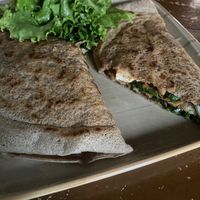 My huge roll: buckwheat crepes filled with hummus, tomato sauce, spinach, grilled oyster mushrooms, grilled aubergines and grilled tofu! at French Creperie and Bar in Kathmandu