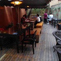 Outdoor seating  at GōngDé Lín - Godly - Huanghe Rd in Shanghai