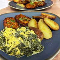 •CREAMED SPINACH -
served with fritters & pan-fried potatoes 👌   at Simple Goodness in Penrith