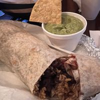 Vegan burrito w/ sriracha cauliflower, chips & guac   at Xtreme Tacos in Tampa