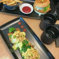 Eggs benedict and fillet of fish sandwich with fries    at Down 2 Earth in Langley