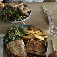 Top plate: chickie sandwich with side salad; bottom plate: Philly sandwich with salad and fries  at Greens & Co in Galway