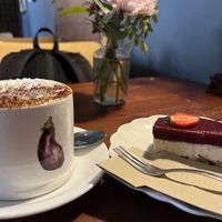Cappuccino with cream and cheesecakee  at Greens & Co in Galway