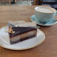 Chai latte and cake at Élelem Etterem in Budapest