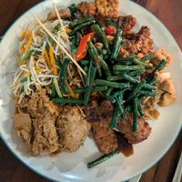 noodles as a base with jackfruit, different types of tempeh dishes, beans, tofu and salad at Warung Local in Canggu