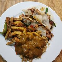 Salt and pepper chips, plain fried rice, curry and jackfruit pancakes. Pancakes are really nice just a bit messy! at Woo Tan Scran - Cloud Kitchen in Liverpool