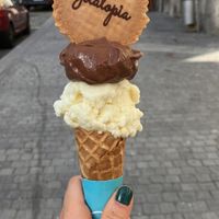 Chocolate and pina colada vegan ice cream. Cone and cookie not vegan.  at Gelatopia in Porto