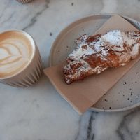 Capuccino and almond croissant at Mica Coffeebar in Haarlem