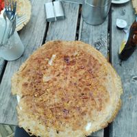 Pannenkoek met appel en rozijnen at Pannekoekenmolen De Graanhalm in Burgh-haamstede