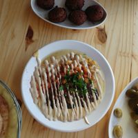 hummus with chickpeas, fava beans and tahini at Tahini's Hummus in Beer Sheva