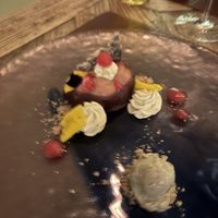 Chocolate pudding, banana mousse and pumpkin sorbet  at Konnubio in Florence