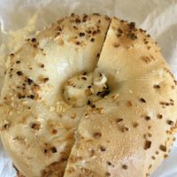 Onion toasted bagel with vegan veggie cream cheese  at Seaford Bagels in Seaford