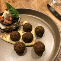 My favorite dish "eggplant".  Eggplant slices layered with "cheese" and super yummy falafels on the side.  at Halapua by Kapuhala in Koh Samui