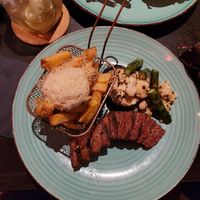 Vegan steak with truffle mayo fries and vegetables at New Vegas in Haarlem
