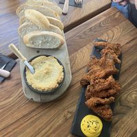 Bread with cashew “Camembert”, and deep fried oyster mushrooms with yuzu mayo dressing  at New Vegas in Haarlem