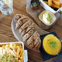 Loaded fries with jackfruit rendang, kaasfondue with  glutenfree bread and polenta with chimichurri. at New Vegas in Haarlem
