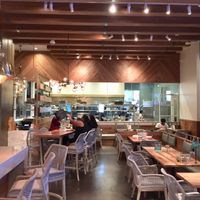 Stylish dining room with open kitchen in rear.  Ample outdoor dining also available. at Tocaya Modern Mexican - Fashion Square in Scottsdale