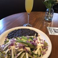 Vegan chiaquiles and mimosa. Yum! at Vegan Avenue in San Antonio