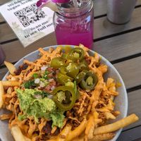 Carne asada fries and dragon fruit lemonade 🍋 at Vegan Avenue in San Antonio