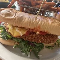 Chicken parm sandwich with sweet potato fries   at Vegan Avenue in San Antonio