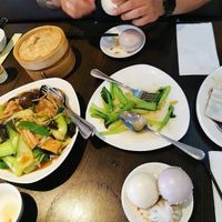 Rice noodles, greens and tofu, greens and garlic, rice noodle roll, and steamed buns at Full Moon Garden in Amsterdam