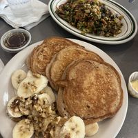 vegan pancakes came w bananas & walnuts; loaded tofu scramble 😍  at The Manatee Cafe in St Augustine