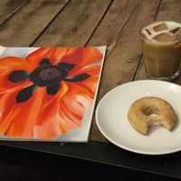 Vegan donut, iced coffee, Georgia O'Keefe book at Silk City Coffee in Manchester