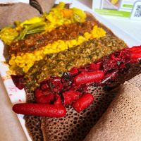 Half Garden Plate with beet and vegetable medley, okra and red lentils, yellow split peas, mushroom, and curry vegetable medley.   at Nile Vegan in Columbus